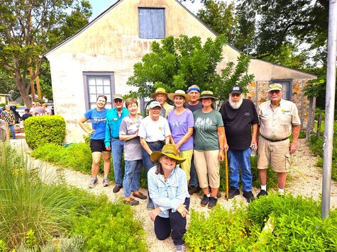 Comal Master Gardeners working in the Lindheimer House Gardens